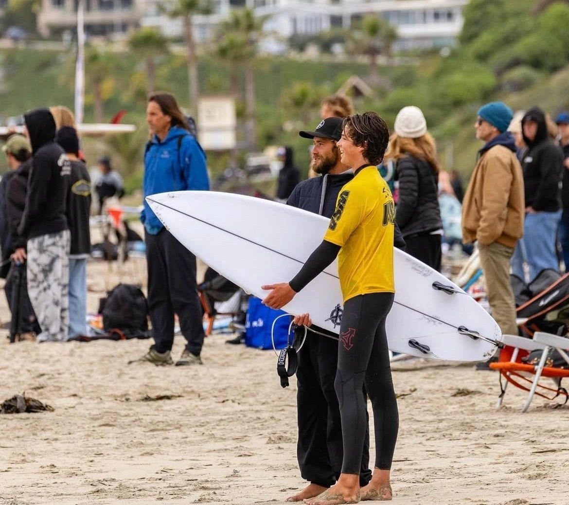 Surfer and coach at the beach