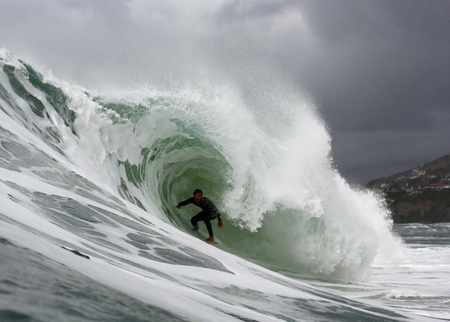 Surfer deep in a heavy barrel